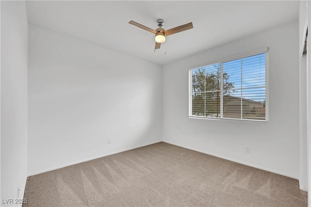 unfurnished room featuring baseboards, a ceiling fan, and carpet flooring