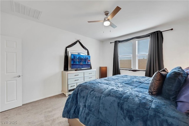 carpeted bedroom featuring visible vents, ceiling fan, and baseboards