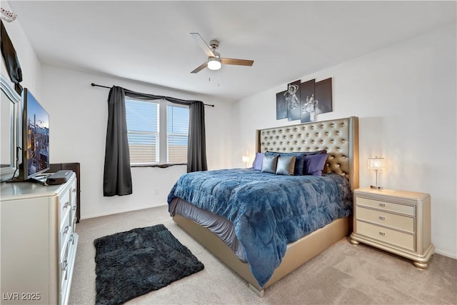 bedroom featuring light carpet and ceiling fan