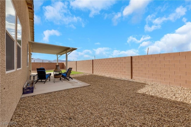 view of yard with a fenced backyard and a patio