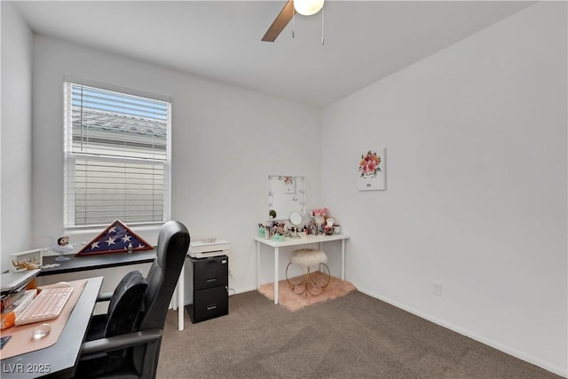 carpeted office with baseboards and ceiling fan