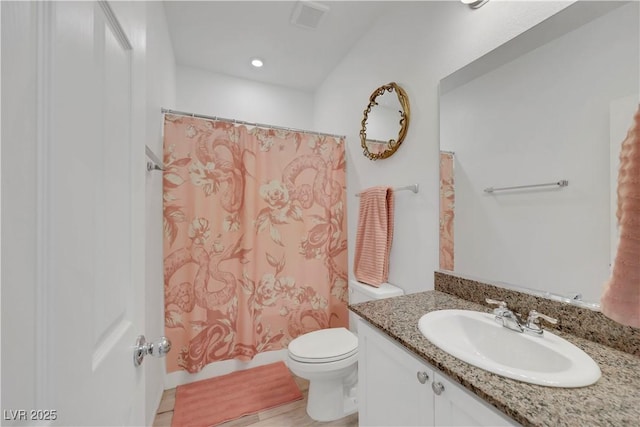 full bath with visible vents, toilet, shower / tub combo with curtain, recessed lighting, and vanity