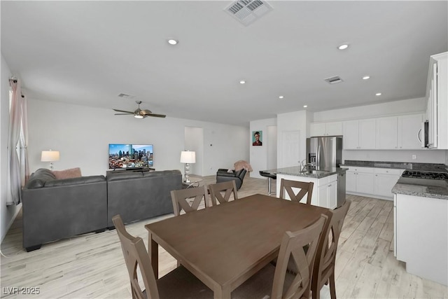 dining space featuring recessed lighting, visible vents, ceiling fan, and light wood finished floors