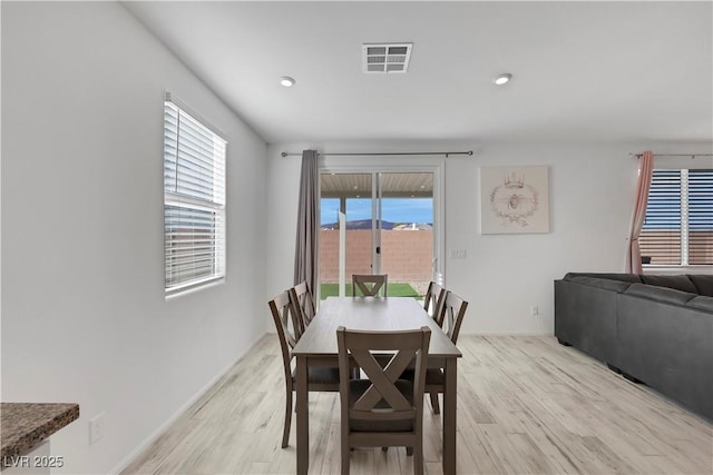 dining area featuring light wood-type flooring, visible vents, and recessed lighting