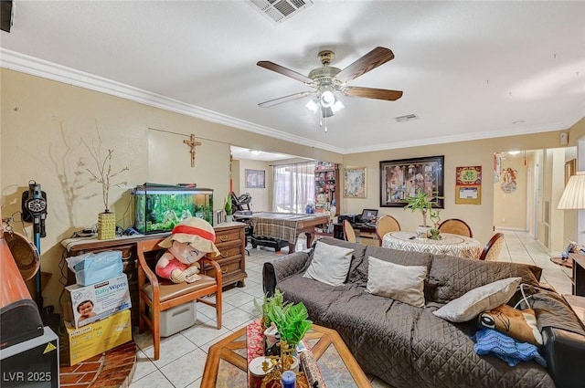 living room featuring ornamental molding, light tile patterned floors, visible vents, and ceiling fan