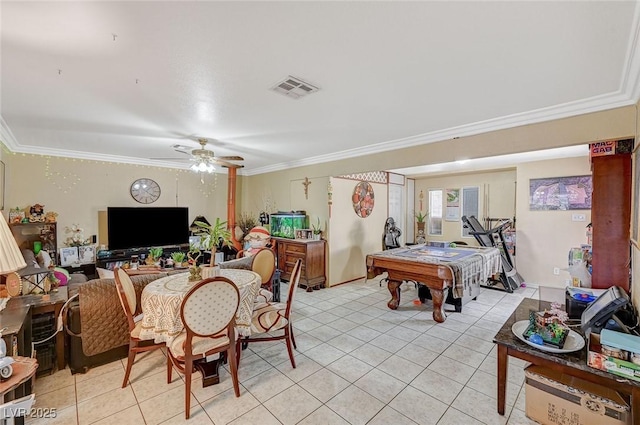 interior space featuring light tile patterned floors, visible vents, ceiling fan, and ornamental molding