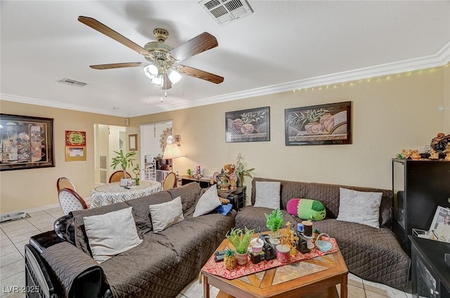 living room with ceiling fan, visible vents, light tile patterned flooring, and crown molding