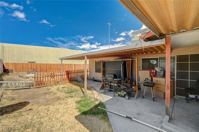 view of yard featuring a patio and fence