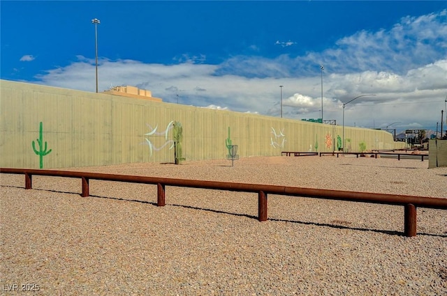 view of playground featuring fence