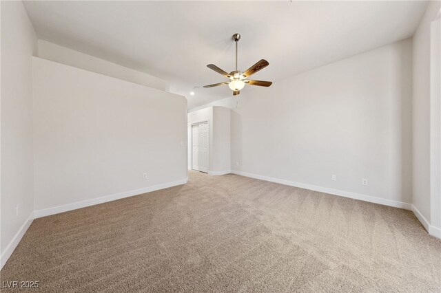 empty room with ceiling fan, baseboards, and carpet floors