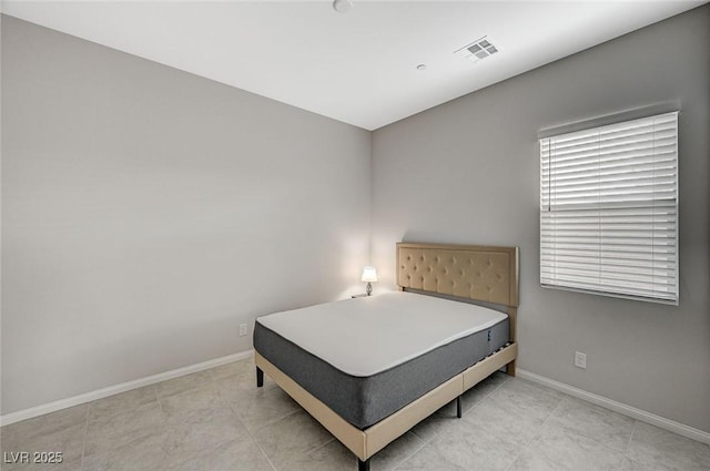 bedroom featuring visible vents and baseboards