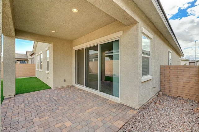 view of patio featuring fence