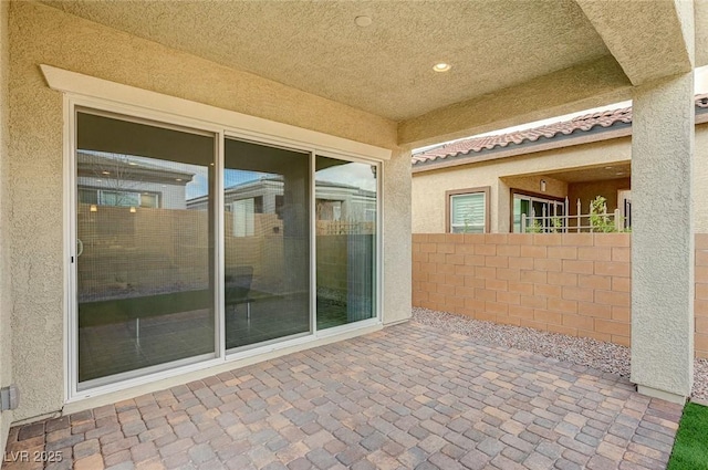 view of patio featuring fence