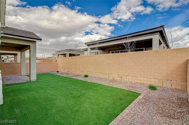 view of yard featuring a fenced backyard