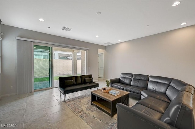 living room featuring light tile patterned floors, recessed lighting, visible vents, and baseboards