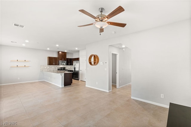 unfurnished living room with recessed lighting, visible vents, ceiling fan, and baseboards