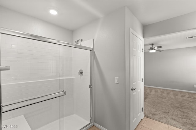 full bath with tile patterned floors, baseboards, visible vents, and a shower stall