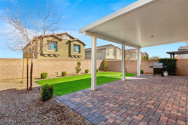 view of patio featuring a grill and a fenced backyard