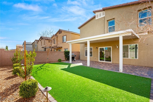 view of yard featuring a patio and a fenced backyard