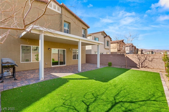 view of yard with a patio and fence