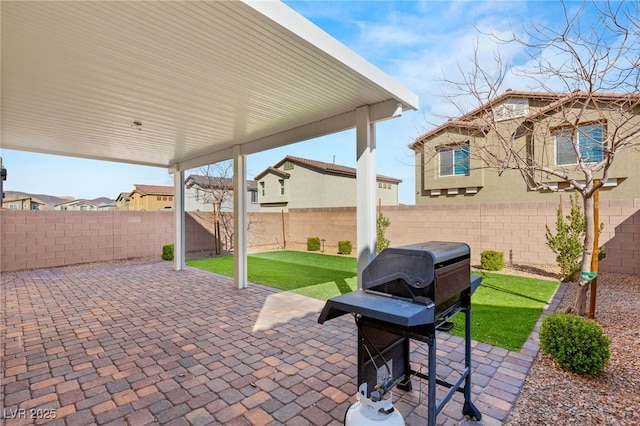 view of patio featuring a grill and a fenced backyard