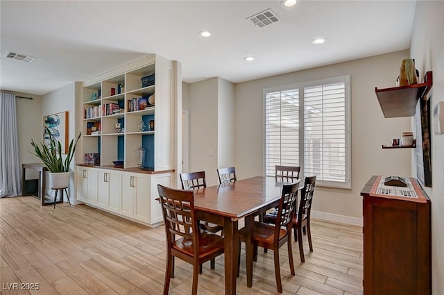 dining space with visible vents, recessed lighting, light wood-type flooring, and baseboards