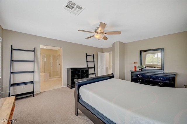 carpeted bedroom featuring connected bathroom, visible vents, and ceiling fan