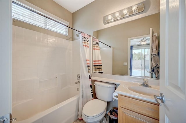 bathroom featuring toilet, vanity, ceiling fan, and shower / bath combo