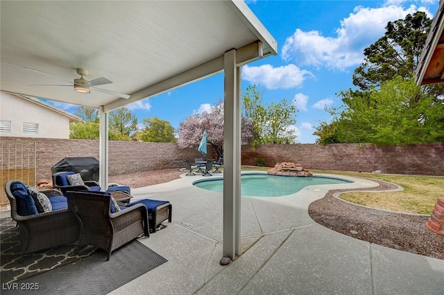 view of swimming pool featuring a fenced in pool, a fenced backyard, a ceiling fan, and a patio area