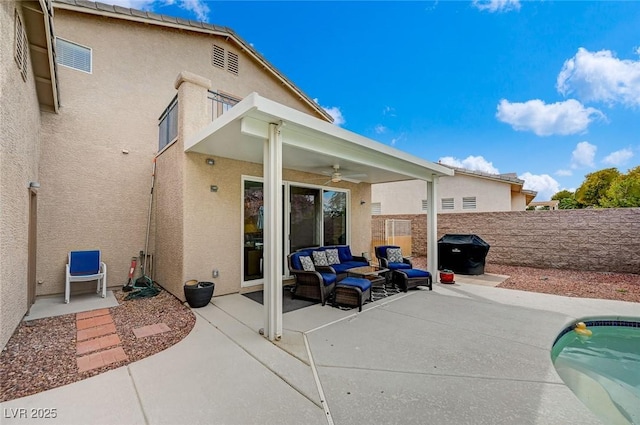 view of patio featuring fence, outdoor lounge area, a fenced in pool, a balcony, and ceiling fan