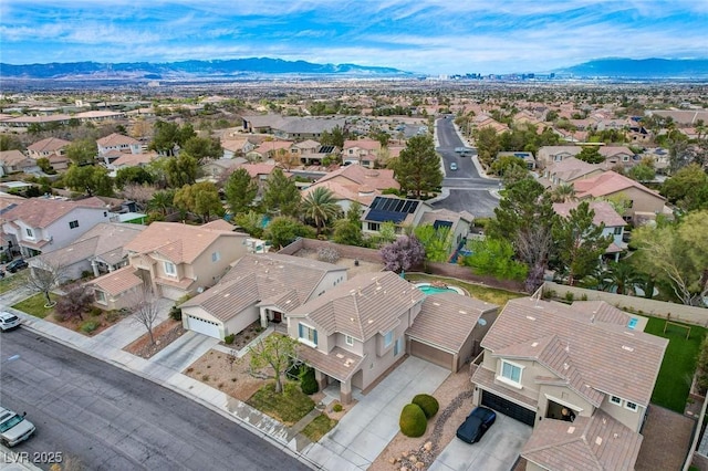 drone / aerial view featuring a mountain view and a residential view