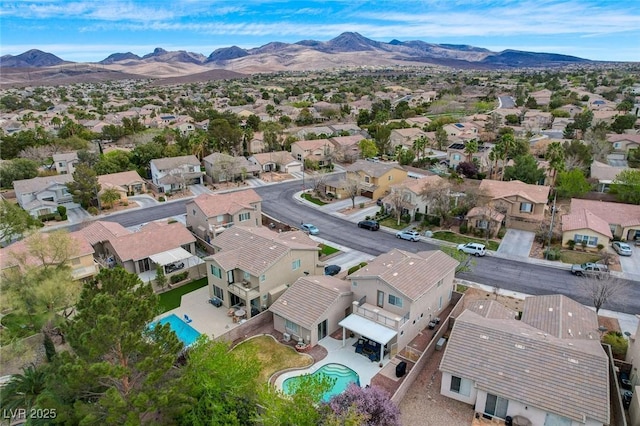 drone / aerial view with a residential view and a mountain view