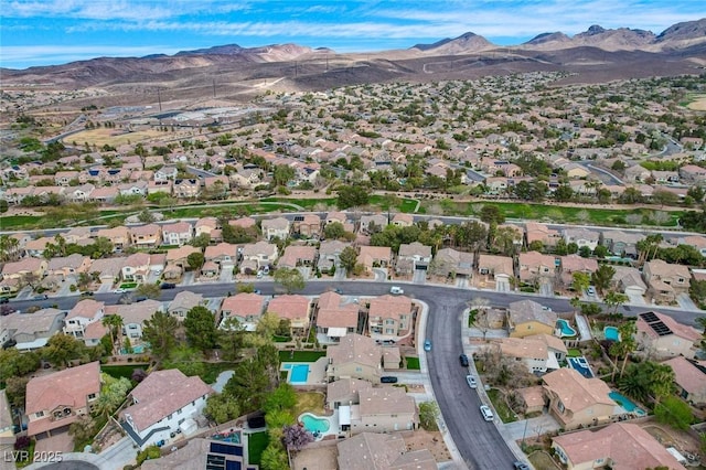 birds eye view of property with a residential view and a mountain view