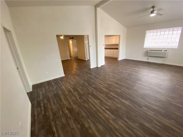 unfurnished living room with a wall mounted air conditioner, beamed ceiling, a ceiling fan, dark wood finished floors, and baseboards