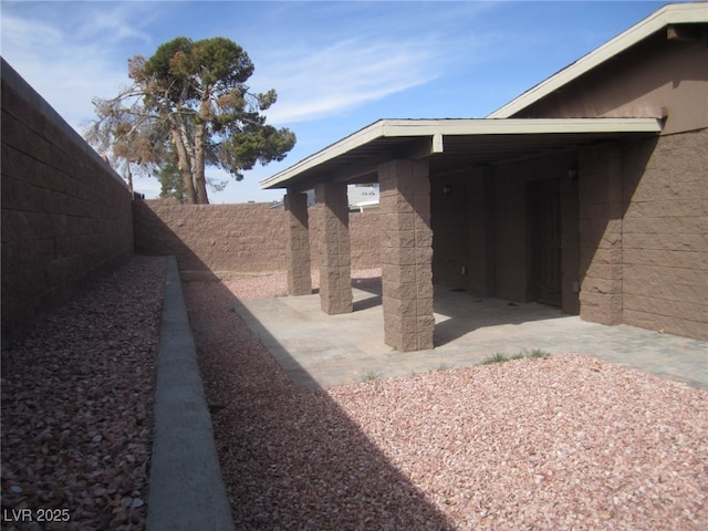 exterior space with a patio and fence