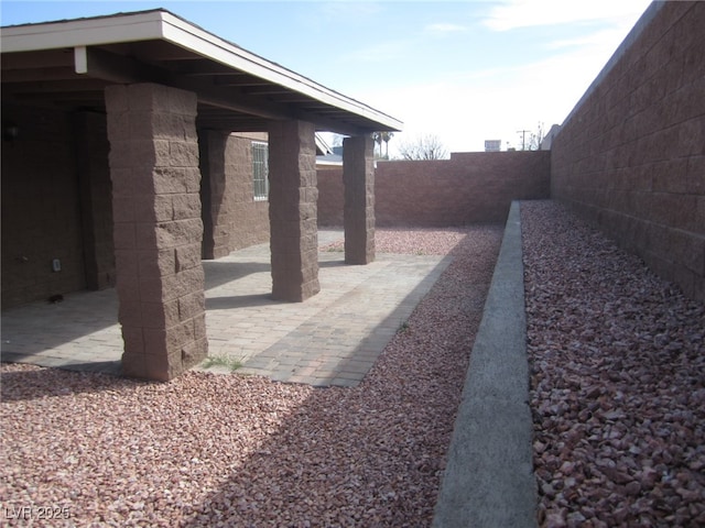 view of yard with a patio and a fenced backyard