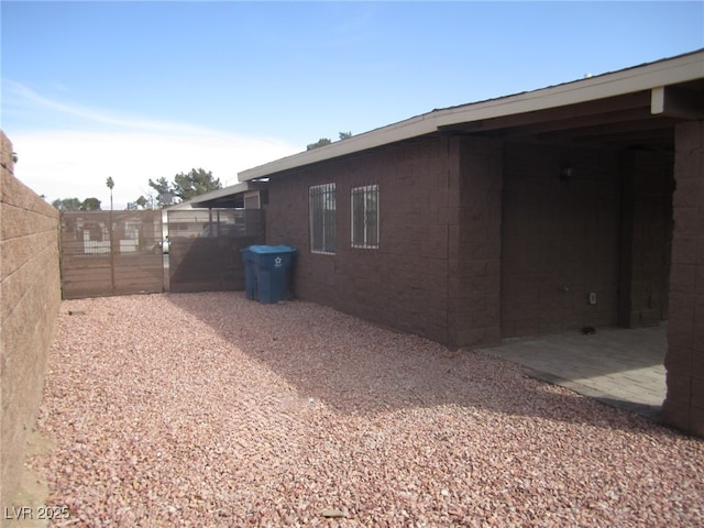 view of property exterior with fence