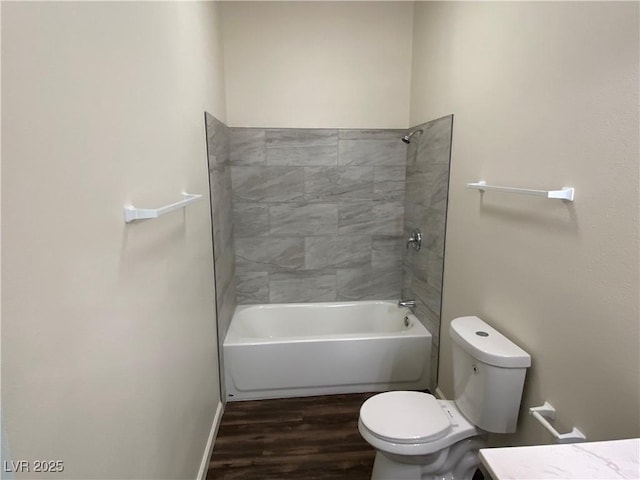 full bath featuring shower / tub combination, toilet, vanity, and wood finished floors