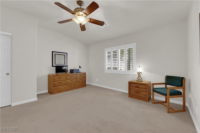 sitting room with baseboards, ceiling fan, and vaulted ceiling