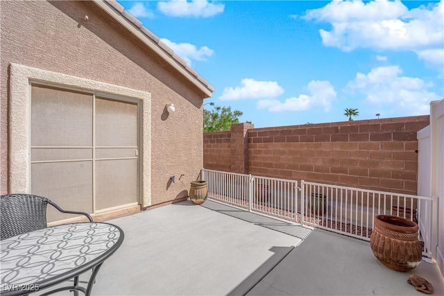 view of patio with fence