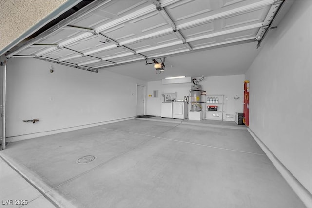 garage featuring a garage door opener and separate washer and dryer