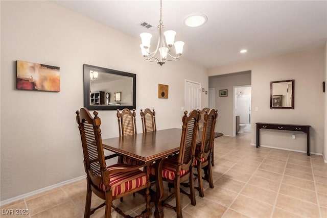 dining room with a notable chandelier, baseboards, visible vents, and light tile patterned floors