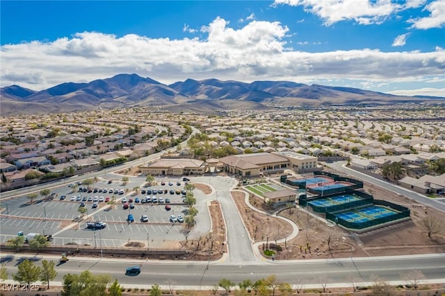 drone / aerial view featuring a residential view and a mountain view