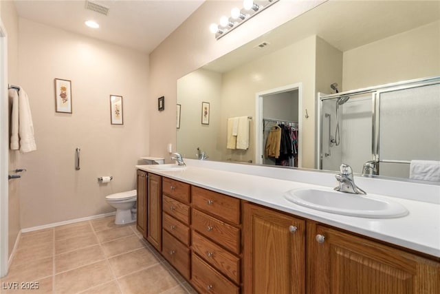 full bathroom with a sink, visible vents, a shower stall, and tile patterned flooring