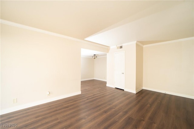 spare room featuring visible vents, baseboards, dark wood-type flooring, and ornamental molding