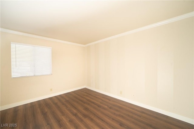 empty room featuring dark wood finished floors, crown molding, and baseboards