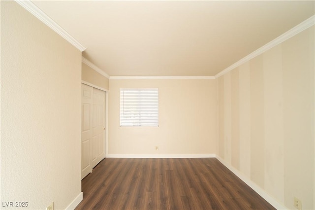 unfurnished room with dark wood-type flooring, crown molding, and baseboards