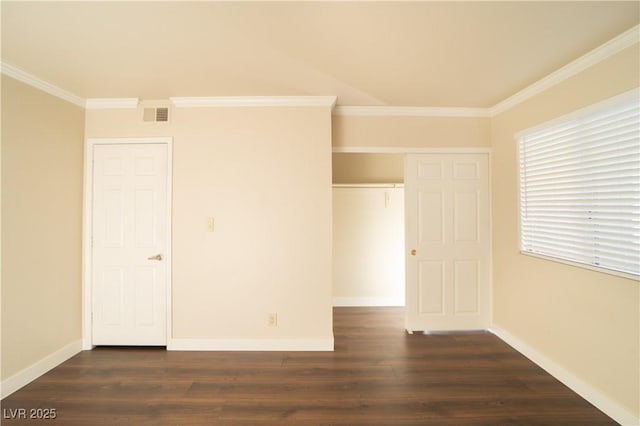 unfurnished bedroom with visible vents, crown molding, baseboards, and dark wood-style flooring