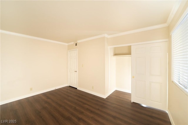 unfurnished room featuring baseboards, dark wood-type flooring, and crown molding