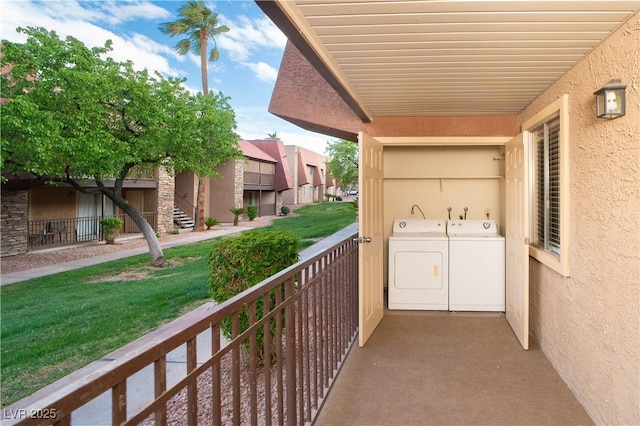 balcony featuring separate washer and dryer